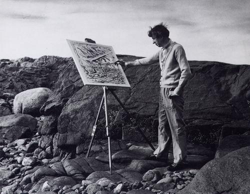 John Marin painting on the rocks at Cape Split in Addison, Maine.  Photographer unknown.  Used by permission of the estate of John Marin.  